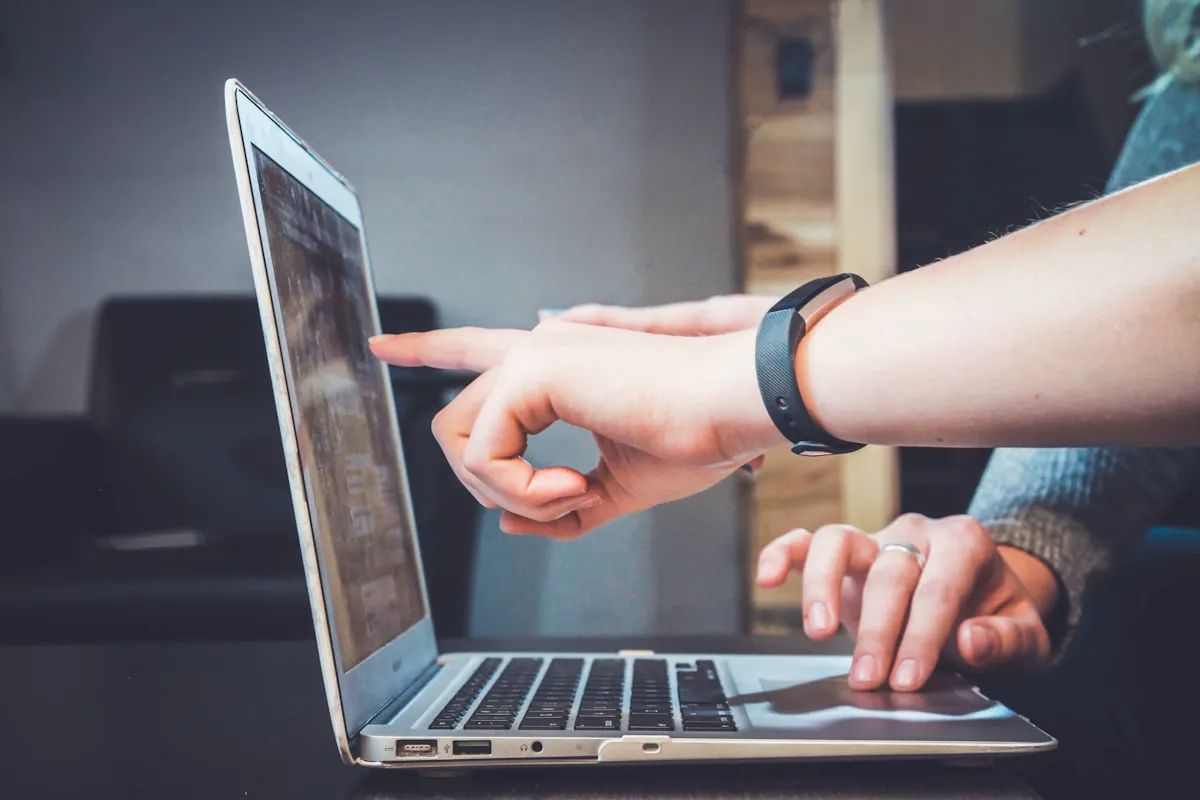 Person calmly using a laptop at home